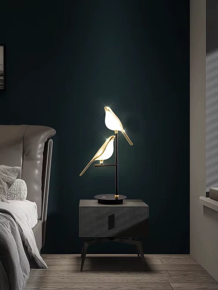 Bellvian bird-shaped table lamp with soft warm LED light on marble nightstand, minimalist bedroom decor.
