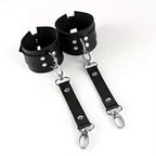 Bellvian black BDSM cuffs with leather inspired finish and fetish roleplay styling, designed as erotic bedroom accessories for sexy couple nights, intimate fashion trends and luxury anniversary or Valentine’s gifts in the UK