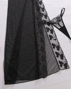 Detail view of Bellvian black transparent side slit mesh nightdress with sexy see through lingerie fabric floral embroidery seductive feminine silhouette luxury honeymoon sleepwear valentines nightwear and glamorous bedroom fashion aesthetic for women UK