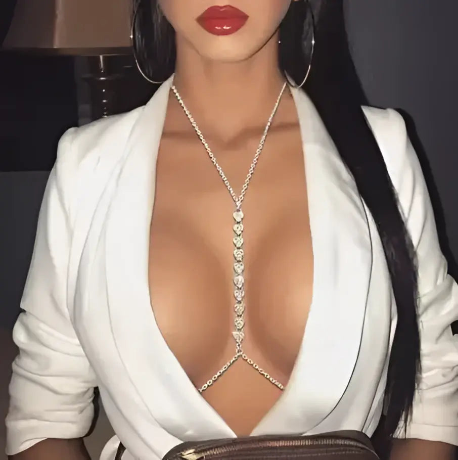 Bellvian crystal body chain necklace styled with deep V neck white blazer featuring sparkling rhinestone detailing luxury women's jewellery UK statement body chain accessory glamorous evening wear party outfit accessory wedding guest jewellery bridal fashion festival jewellery luxury gift for girlfriend anniversary gift for wife premium body jewellery and elegant occasion styling