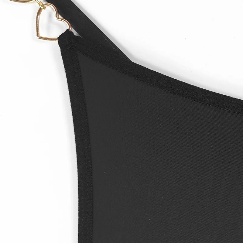 Close up view of the metallic heart chain detail featured on a luxury thong lingerie design. Showcasing premium craftsmanship and elegant styling for women seeking high quality sexy underwear and romantic lingerie.