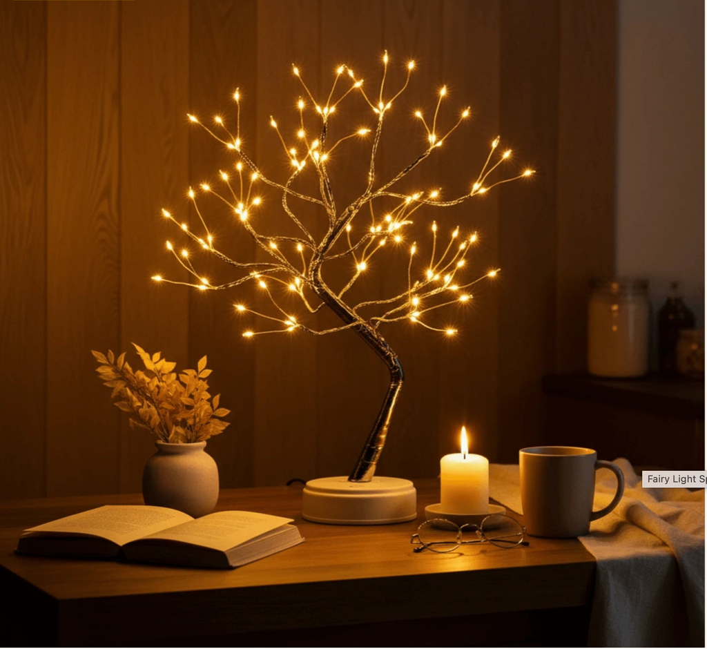 108 LED Fairy Light Tree Lamp illuminating a cozy wooden bedside table with an open book, candle, and coffee mug  perfect ambient night light for reading and relaxation. Bellvian