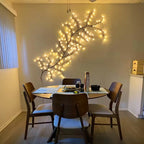 Elegant Bellvian LED vine lamp decorating a modern dining room wall, featuring flexible warm white fairy lights for a soft, relaxing atmosphere.