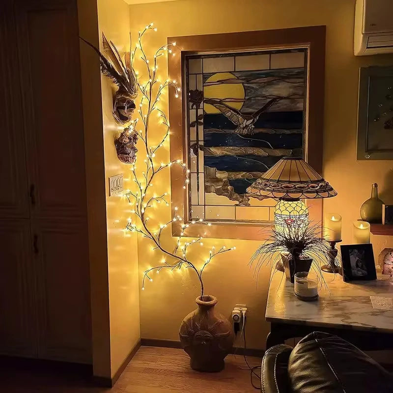 Bellvian Willow Vine LED Light placed in a tall vase, adding soft illumination and artistic design to a cozy corner home setup.