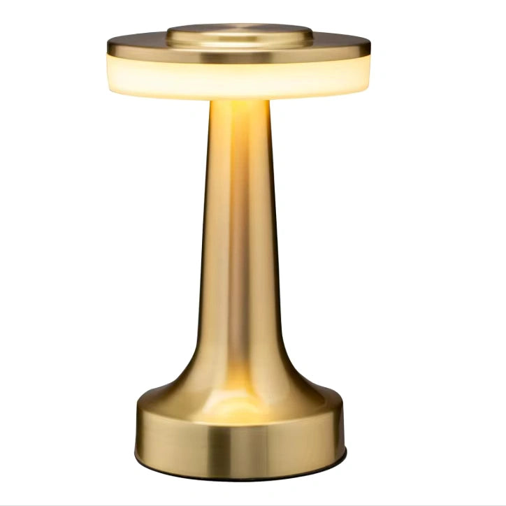 Minimalist table lamp placed on an elegant dining table with warm ambient light, modern decor, and polished cutlery Bellvian modern home lighting.