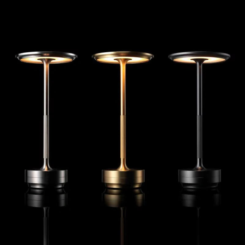 Bellvian modern aluminum LED table lamp in silver finish, featuring a slim stem, round head and smooth base, photographed on a white background showcasing minimalist contemporary lighting design.