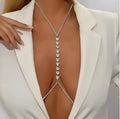 Bellvian silver rhinestone body chain necklace shown in close up detail with deep plunge blazer styling featuring sparkling crystal jewellery luxury body accessory for women UK statement fashion jewellery sexy body chain necklace evening outfit accessory party jewellery wedding guest accessory bridal body jewellery festival fashion luxury gift for girlfriend gift for wife and glamorous occasion wear styling
