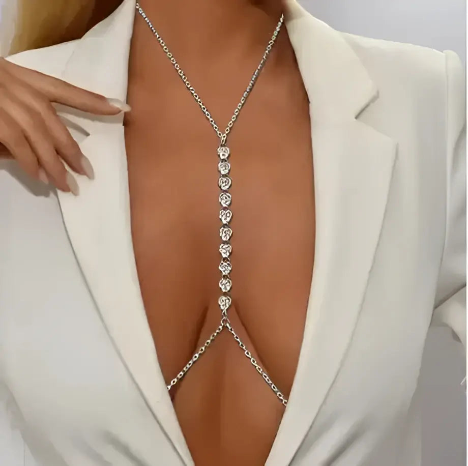 Bellvian silver rhinestone body chain necklace shown in close up detail with deep plunge blazer styling featuring sparkling crystal jewellery luxury body accessory for women UK statement fashion jewellery sexy body chain necklace evening outfit accessory party jewellery wedding guest accessory bridal body jewellery festival fashion luxury gift for girlfriend gift for wife and glamorous occasion wear styling