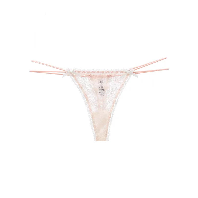 Soft pink lace thong displayed in a product image with delicate floral lace detailing, ribbon bow accents and a romantic feminine design. Ideal for bridal lingerie collections, honeymoon outfits, anniversary gifts and women who appreciate elegant luxury underwear.