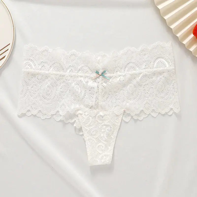 Bellvian white lace cheeky thong panties featuring soft floral lace fabric, elegant feminine styling and comfortable luxury fit, premium women's underwear designed for bridal lingerie collections, honeymoon wardrobes and romantic occasions, perfect gift for bride, wife or girlfriend seeking luxury intimate fashion and premium lingerie in the UK.