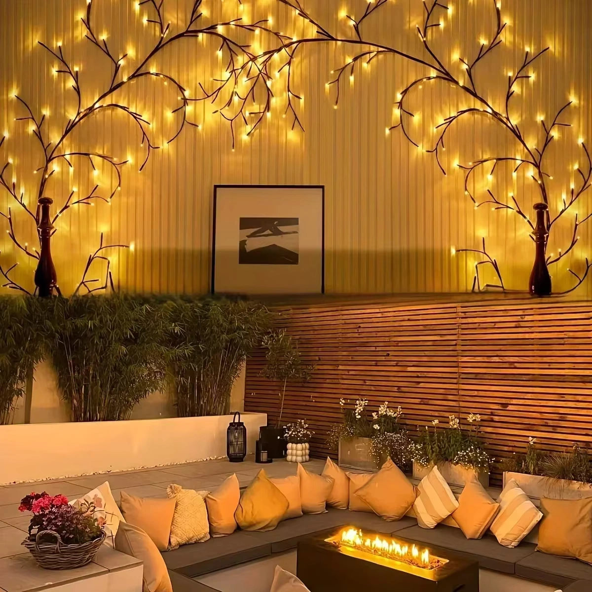 Warm and romantic outdoor patio lighting with Bellvian Willow Vine LED Lights arching above seating area, ideal for garden and evening decor.