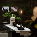 Decorative black and gold bedside LED lamp with a soft ambient glow, sleek body, and minimalist design. Enhances bedroom or living room atmosphere with elegant lighting — Bellvian modern lamp collection.