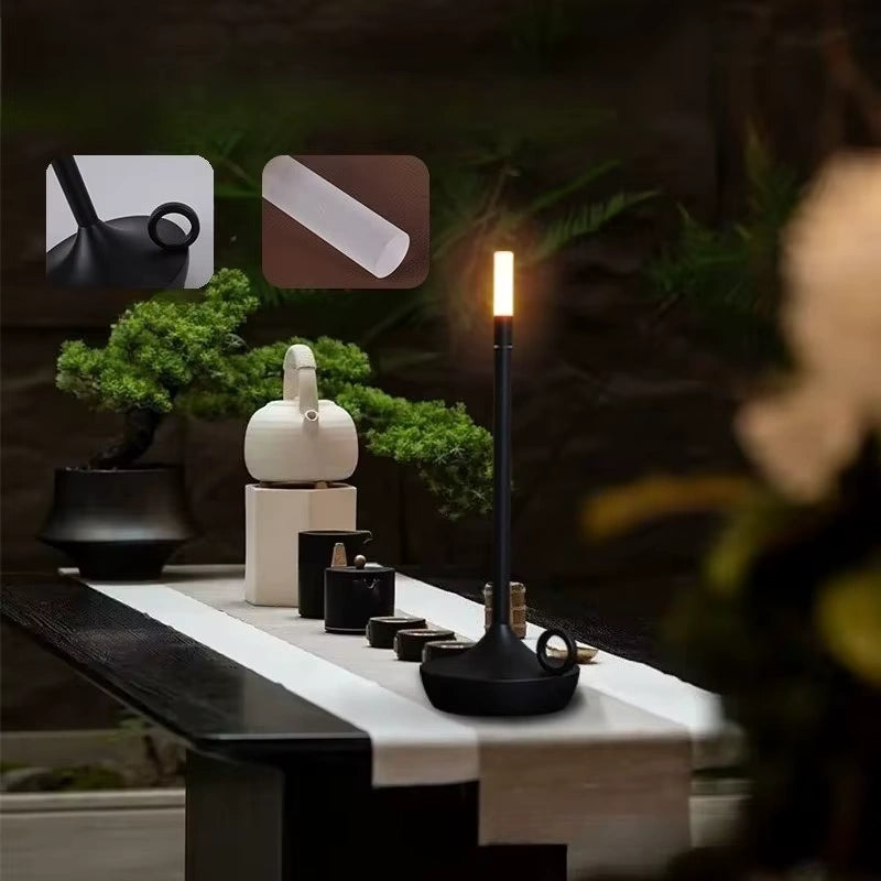 Decorative black and gold bedside LED lamp with a soft ambient glow, sleek body, and minimalist design. Enhances bedroom or living room atmosphere with elegant lighting — Bellvian modern lamp collection.