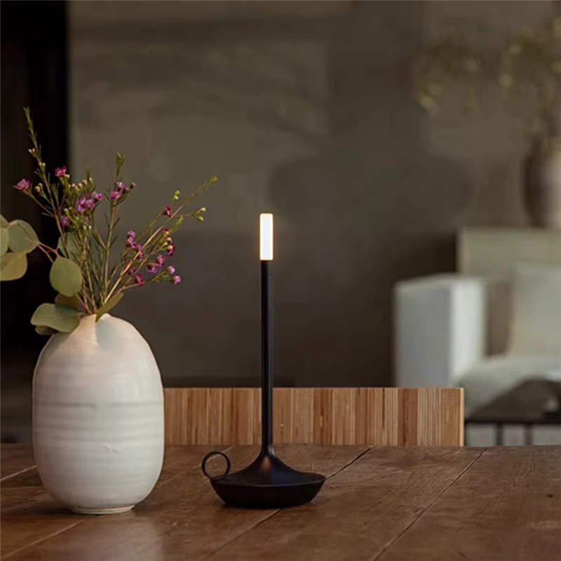 Sophisticated LED table lamp with gold metallic accents and circular base, designed with wireless rechargeable battery and warm light tone. Perfect for contemporary interiors — Bellvian luxury lighting piece.